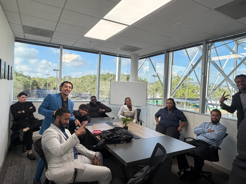 Fineline Vision staff collaborating during a sales and marketing training session