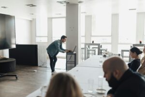 A man preparing a presentation on the benefits of management training