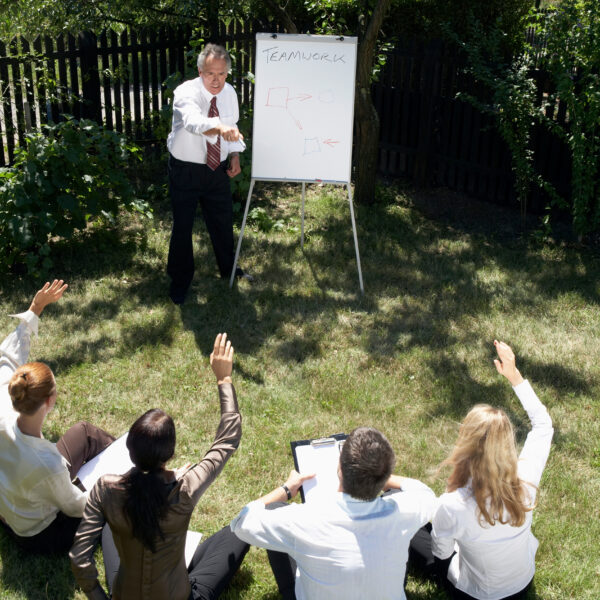 A leadership training session on employee performance held outside